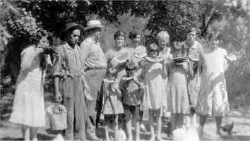 Osgood and Sarah Pasley Moore plus children and grandchildren eating watermelons photo